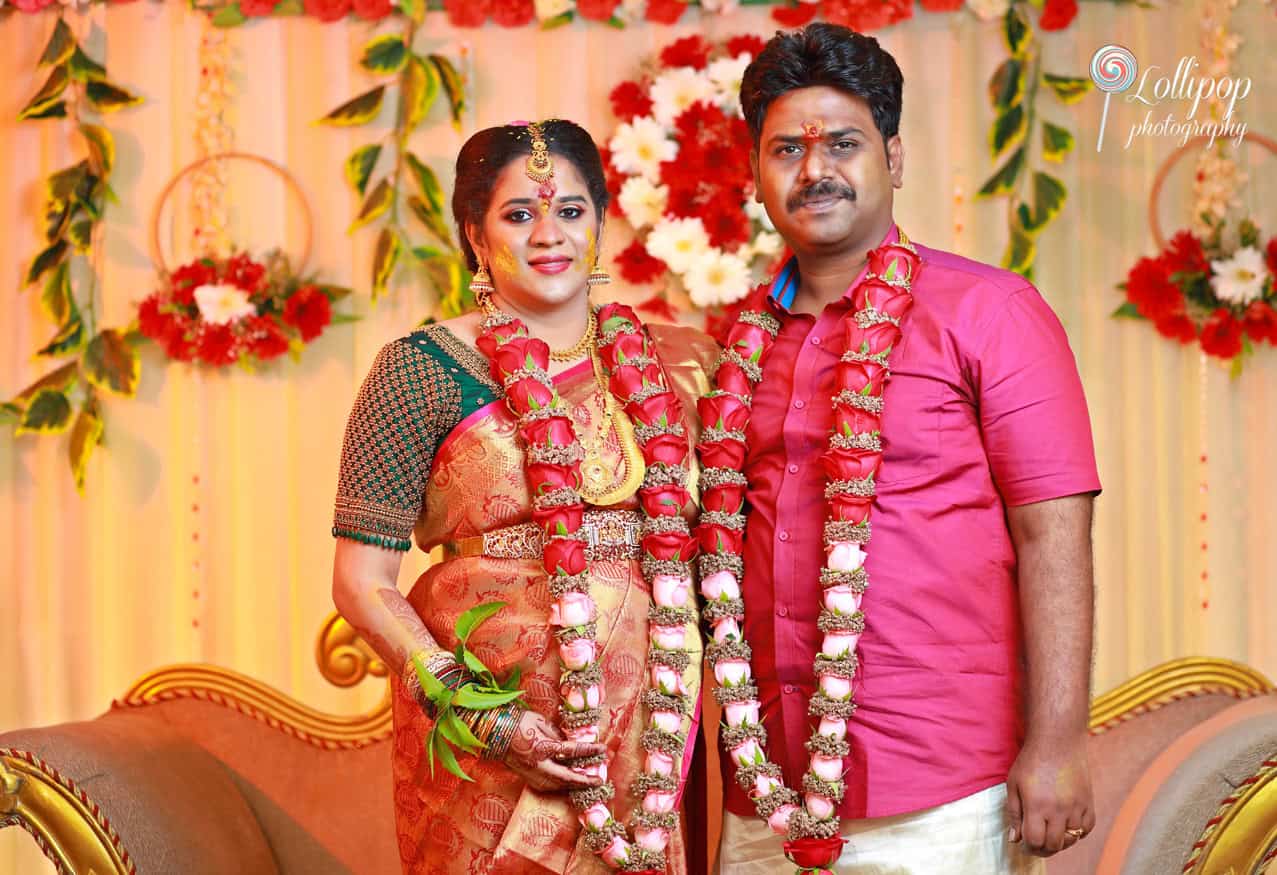 Elegant couple in traditional attire celebrating their baby shower with Lollipop Photography, highlighting love and anticipation.