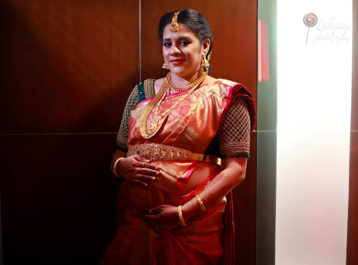 A stylish maternity photoshoot capturing the essence of traditional South Indian fashion with a modern twist in Chennai