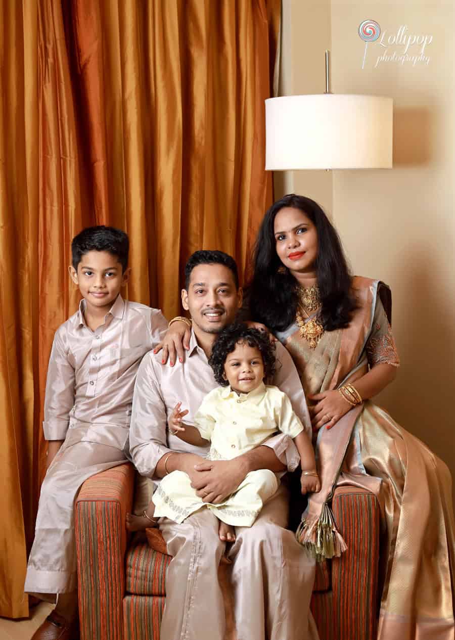 A beautiful family portrait of Aryan with his parents and elder brother during his birthday celebration in Chennai, photographed by Lollipop Photography