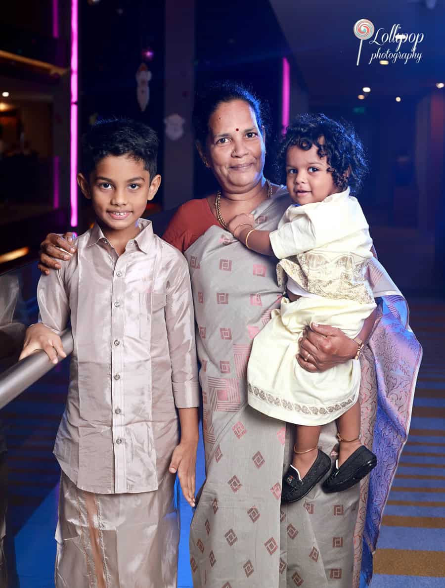 A warm family moment featuring Aryan’s grandmother holding him alongside his older brother, taken during Aryan’s birthday celebration by Lollipop Photography