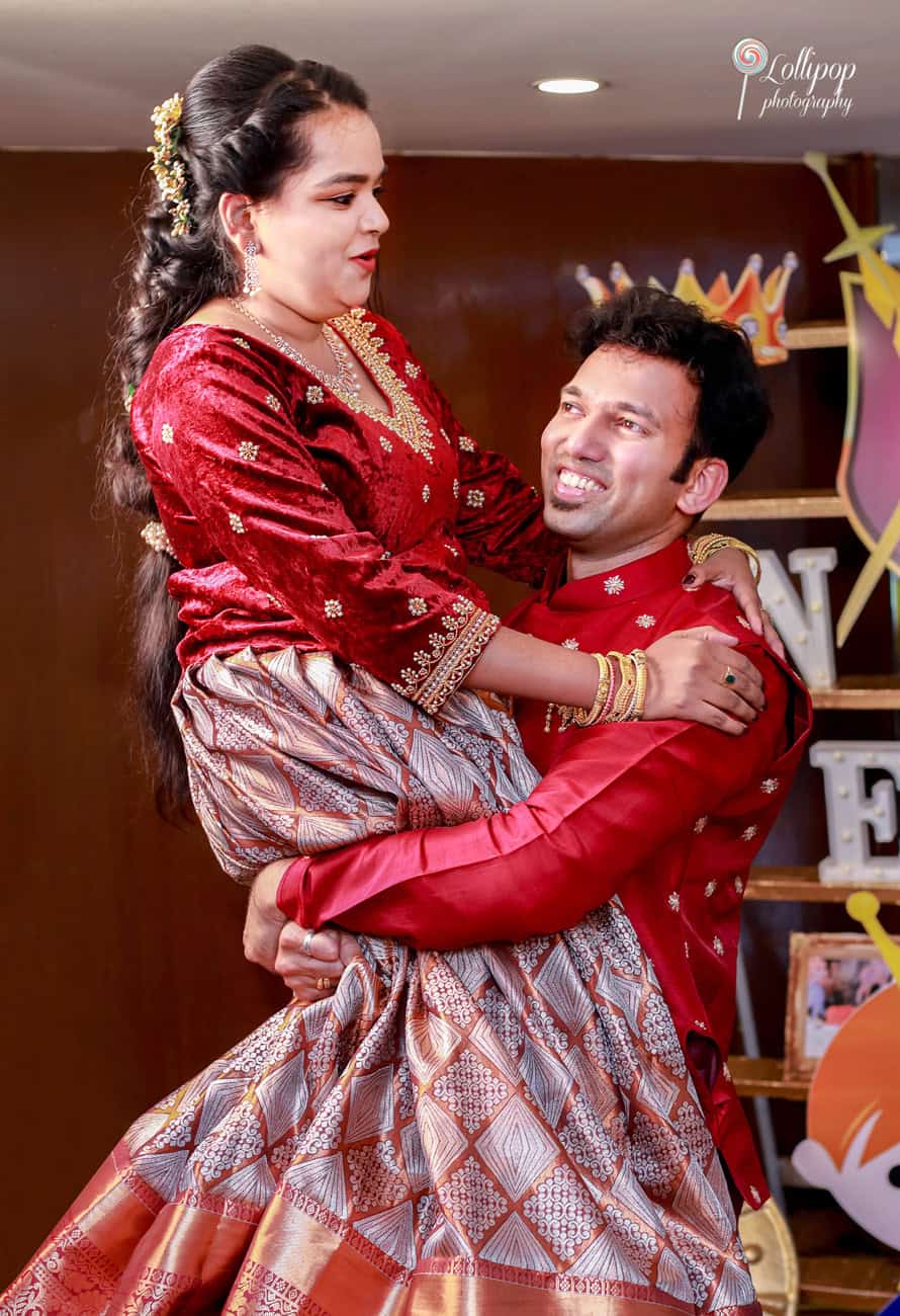 A joyful moment as the couple shares a dance, with a playful lift, celebrating Nathaniel's birthday with laughter and love.