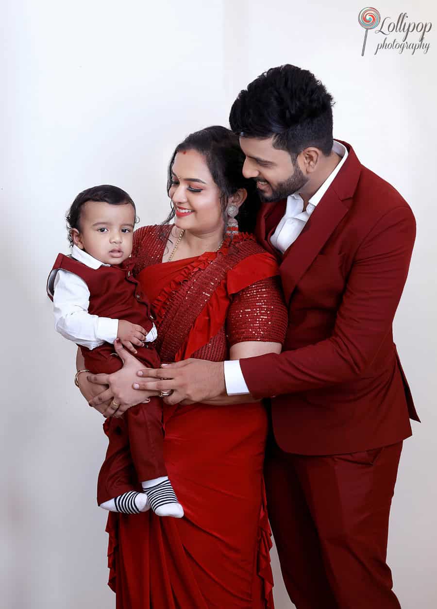 A tender moment as Kian's parents hold him close during his birthday photoshoot by Lollipop Photography in Chennai