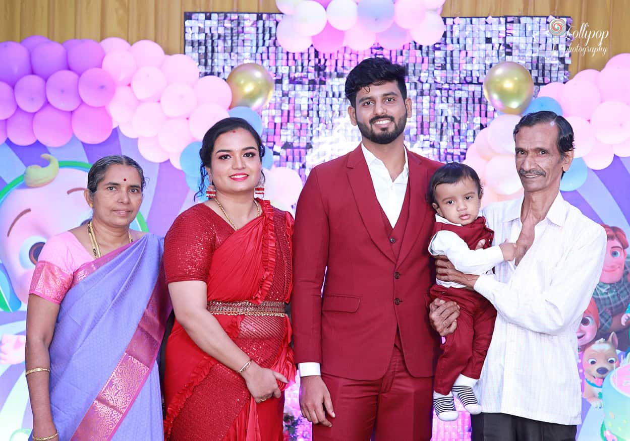 Kian with his parents and grandparents posing for a family portrait at his birthday celebration in Chennai, beautifully captured by Lollipop Photography.