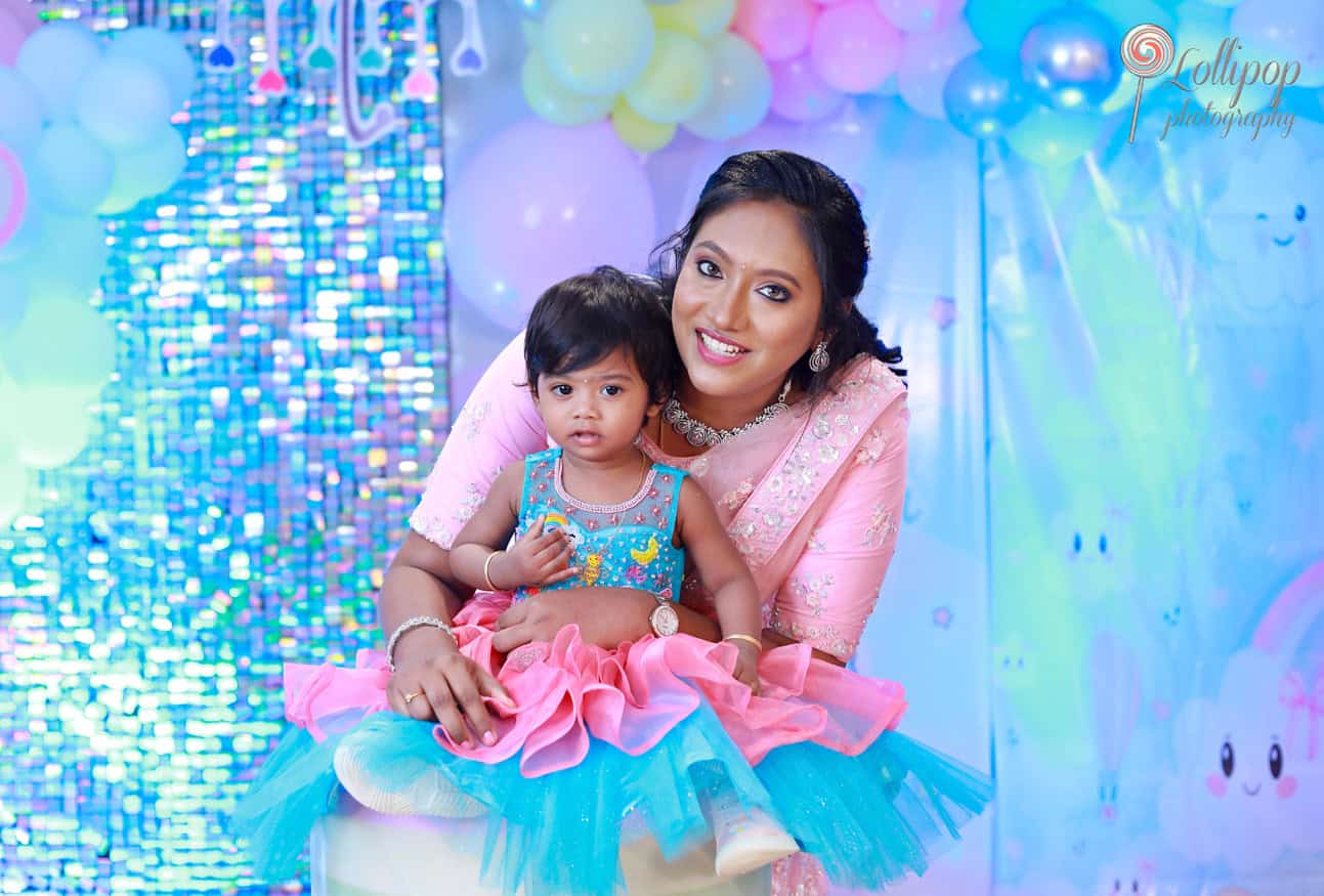 A beautiful moment between mother and daughter at Kanali's birthday celebration, captured by Lollipop Photography in Chennai