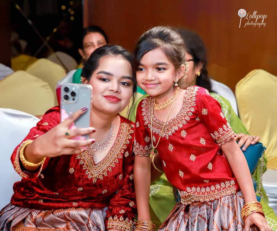 A heartfelt mother-daughter selfie moment at Nathaniel's birthday celebration, captured by Lollipop Photography.