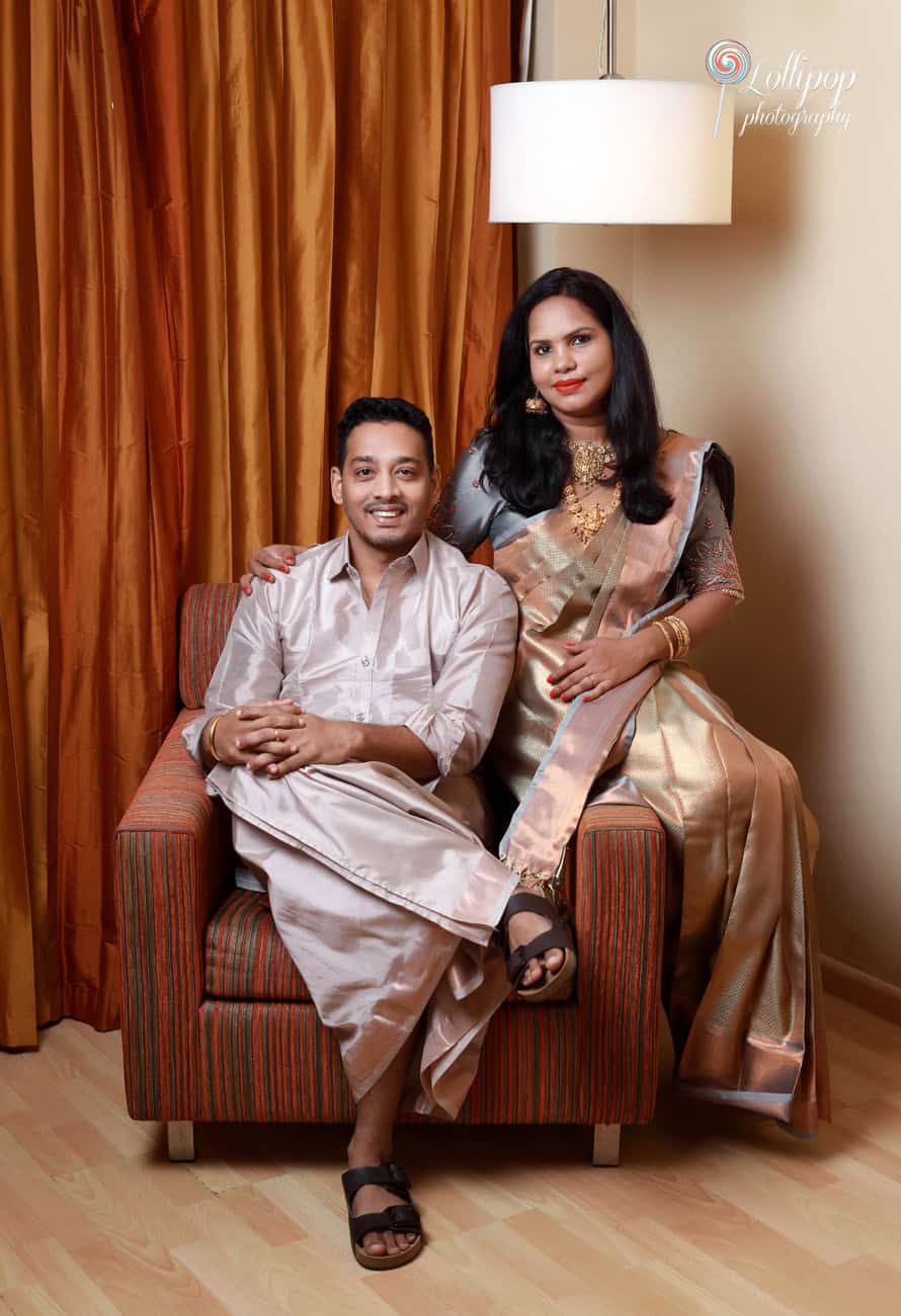 Aryan’s parents pose elegantly in traditional attire, celebrating the occasion with grace, captured by Lollipop Photography