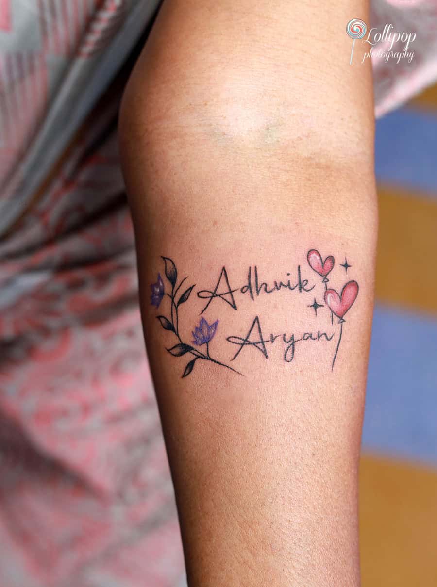 A close-up of a meaningful tattoo tribute with the names Adhvik and Aryan, photographed during Aryan’s birthday celebration by Lollipop Photography.