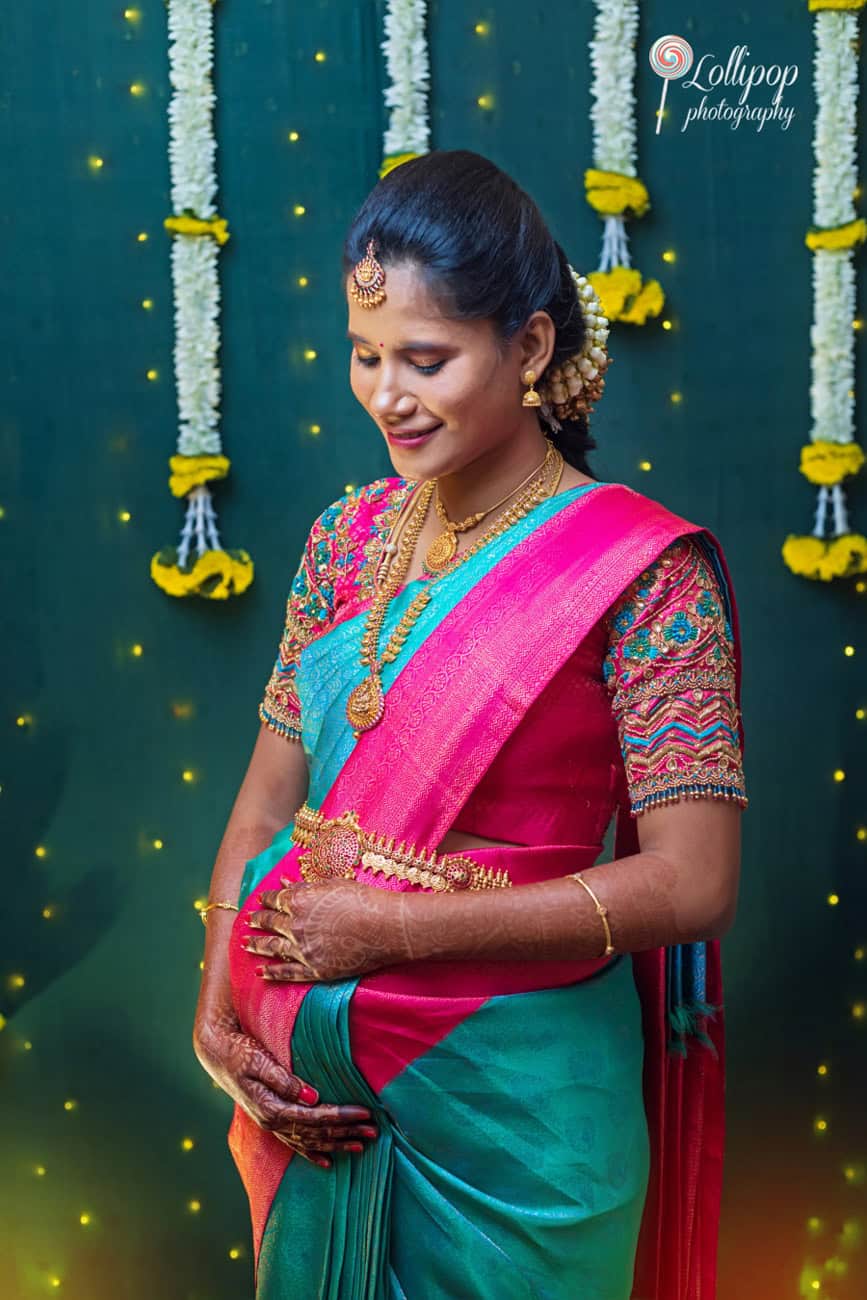 "Arthi posing beautifully in traditional attire during her baby shower, showcasing cultural elegance, captured by Lollipop Photography in Chennai.