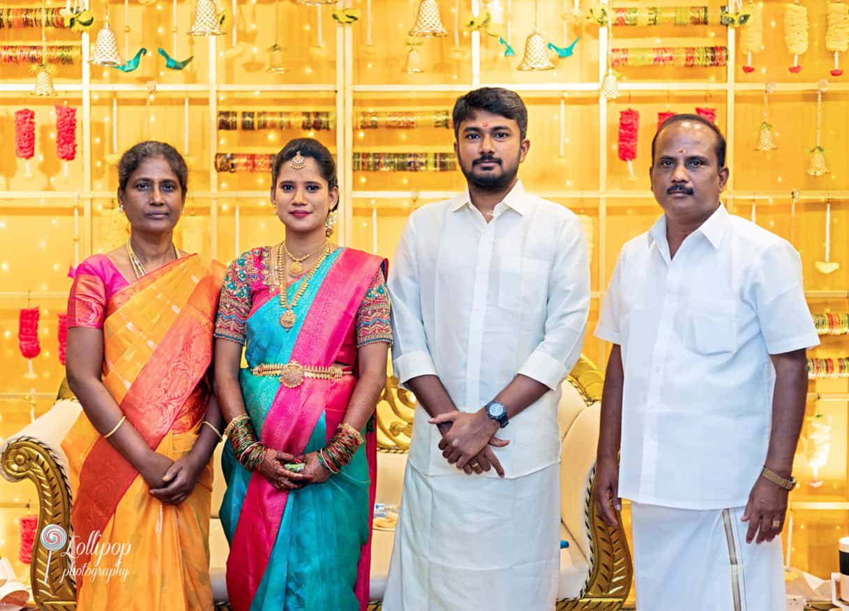 Arthi and Naveen Kumar posing with their parents during the baby shower celebration in Chennai, captured by Lollipop Photography.