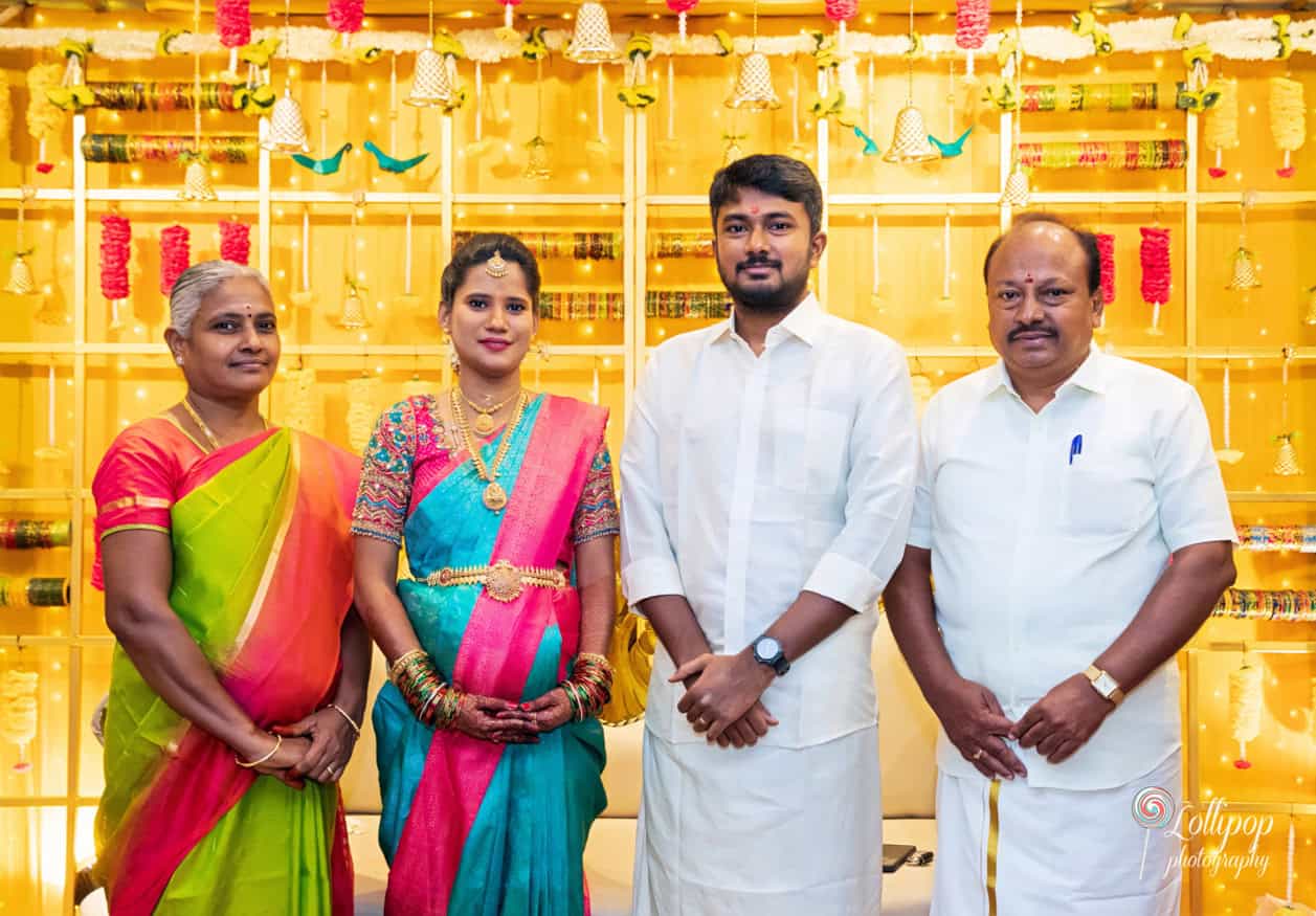 Special moment with Arthi and Naveen Kumar together with in-laws at their baby shower in Chennai, surrounded by traditional decorations, captured by Lollipop Photography.