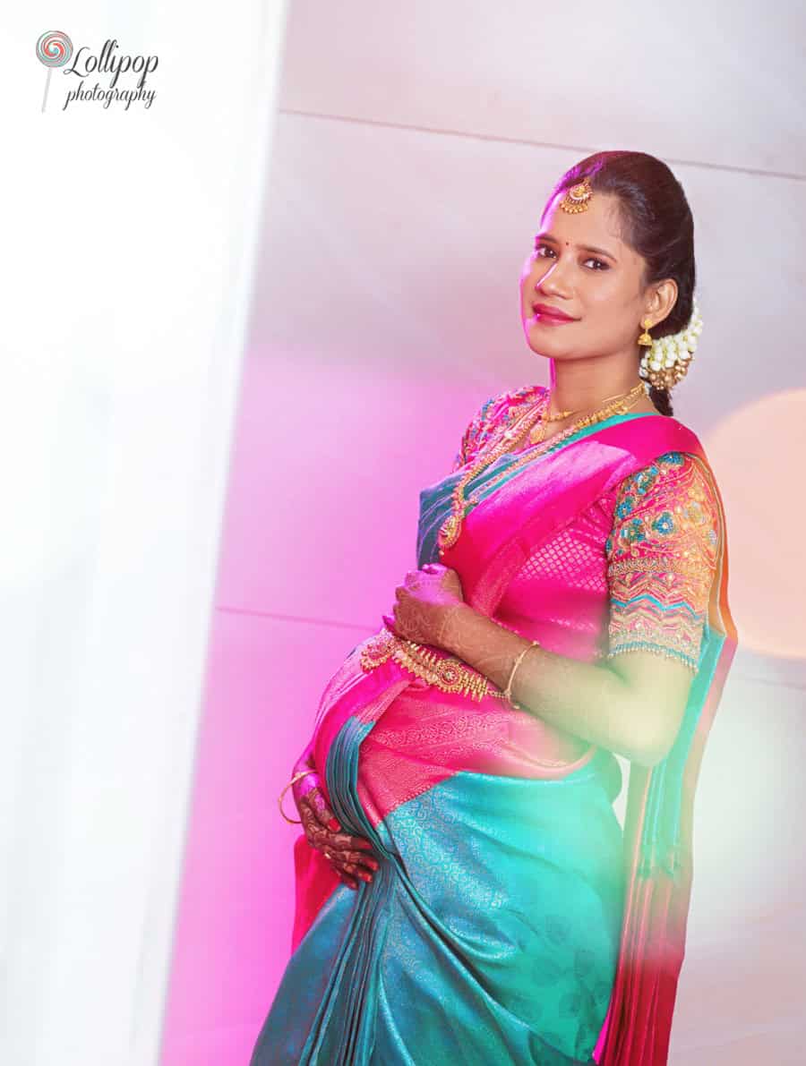 Beautiful baby shower photoshoot in traditional attire captured by Lollipop Photography in Chennai, highlighting the vibrant colors and cultural essence.