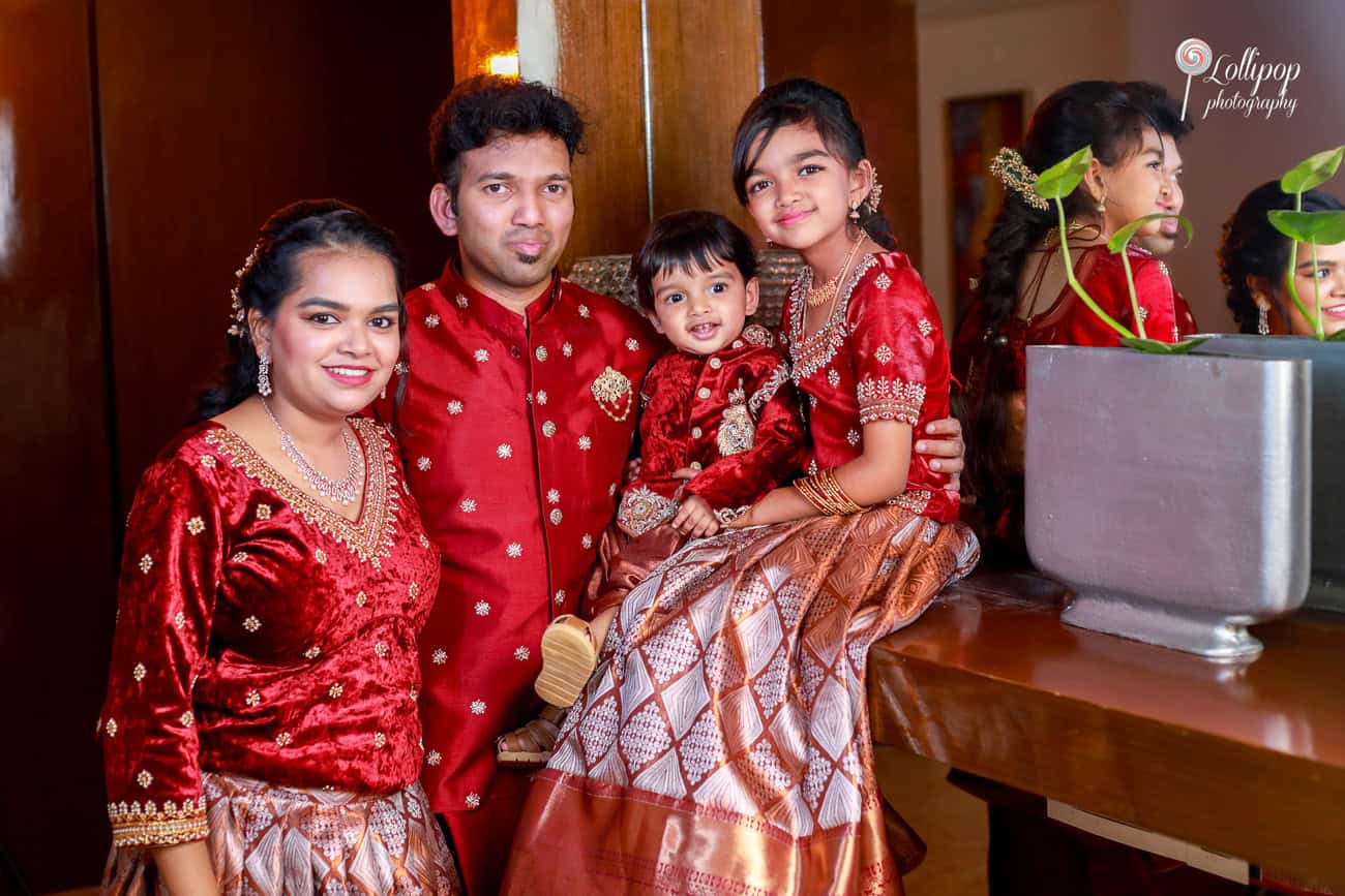 Nathaniel with family in matching red outfits during his birthday photoshoot in Chennai