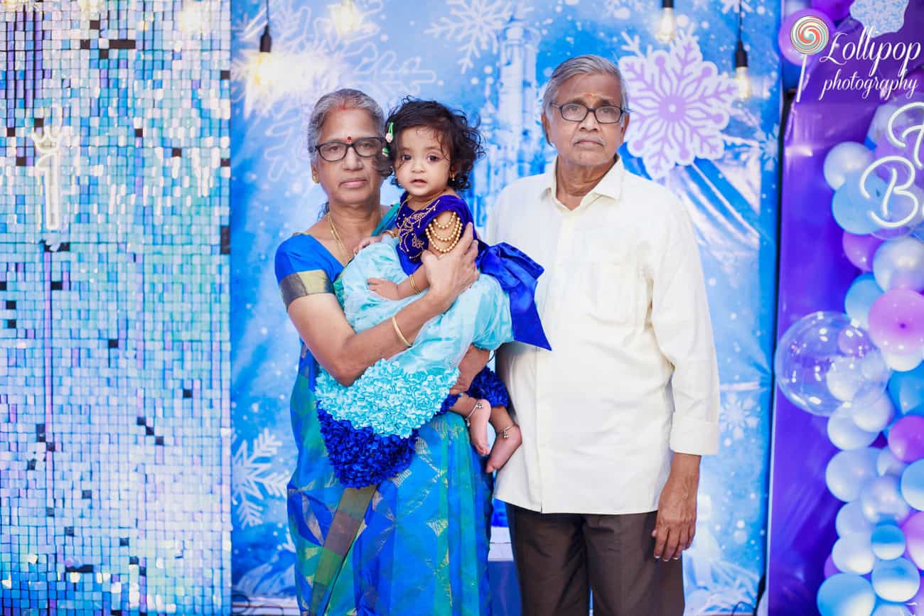 Pranika poses with her grandparents during her birthday photoshoot in Coimbatore