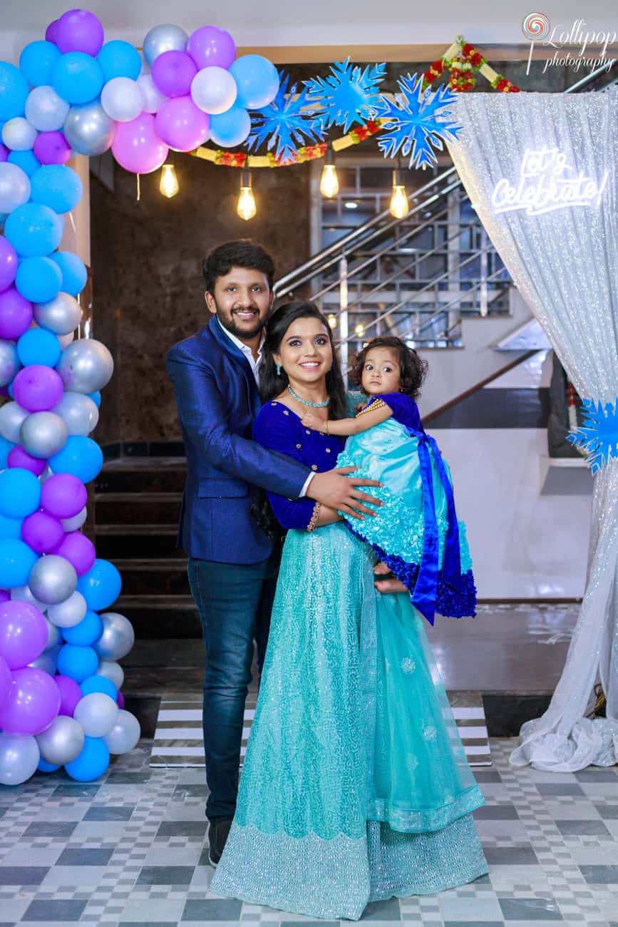 Pranika’s parents hold her close during her birthday photoshoot with a Coimbatore photographer.