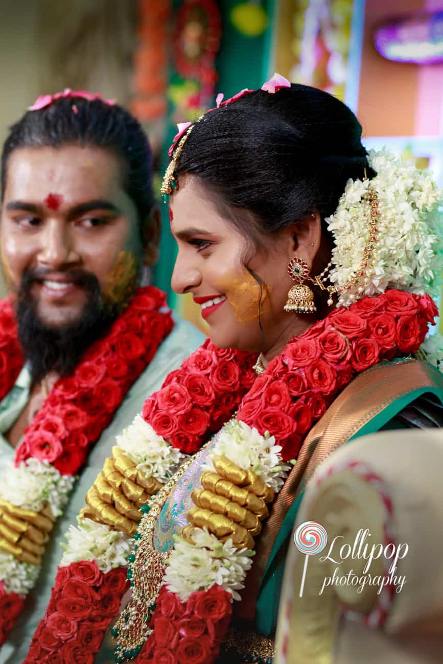 A proud portrait of Sharmila's partner, embracing the traditions of the baby shower ceremony in Coimbatore, photographed by Lollipop Photography