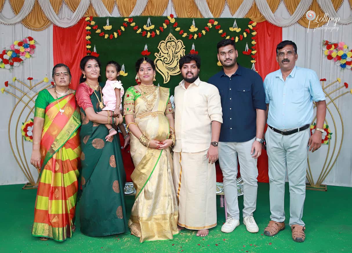 Family members gather for a group photo at Anitha's baby shower, cherishing the celebration of new beginnings in Coimbatore