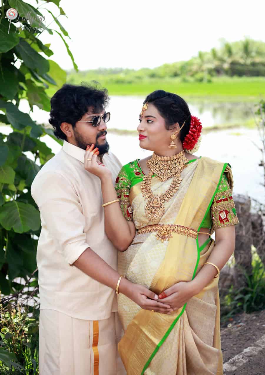 Anitha and her husband share a lighthearted moment, celebrating their upcoming arrival amidst nature in Coimbatore