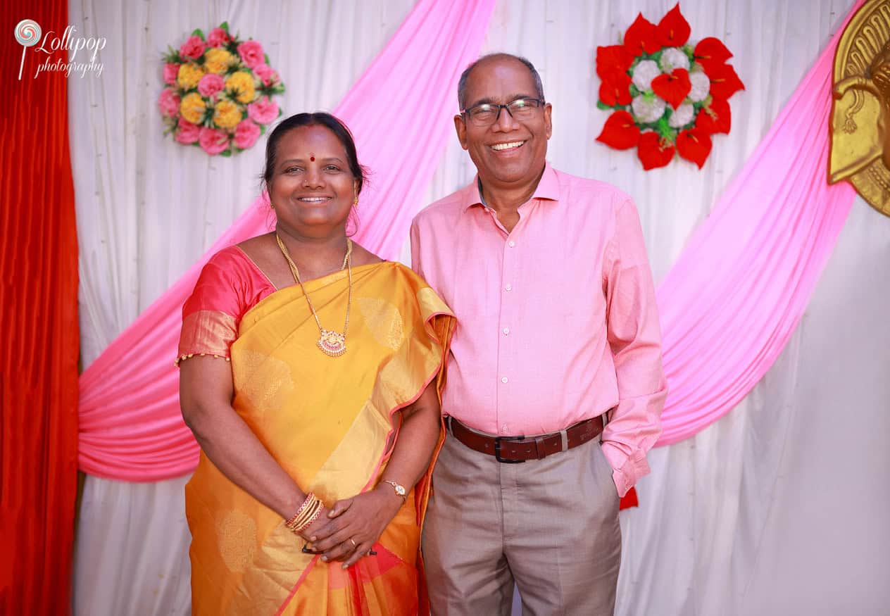 Joyful parents-in-law smiling together, celebrating the baby shower of their beloved daughter-in-law in Coimbatore, beautifully captured by Lollipop Photography