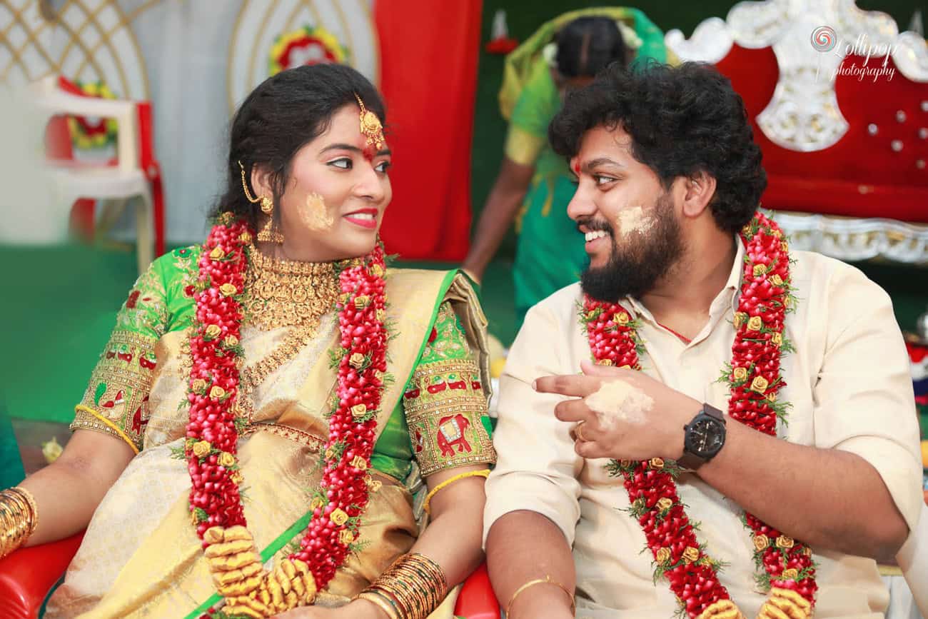 Anitha and her husband share a joyful laugh, radiating love and excitement during the baby shower in Coimbatore