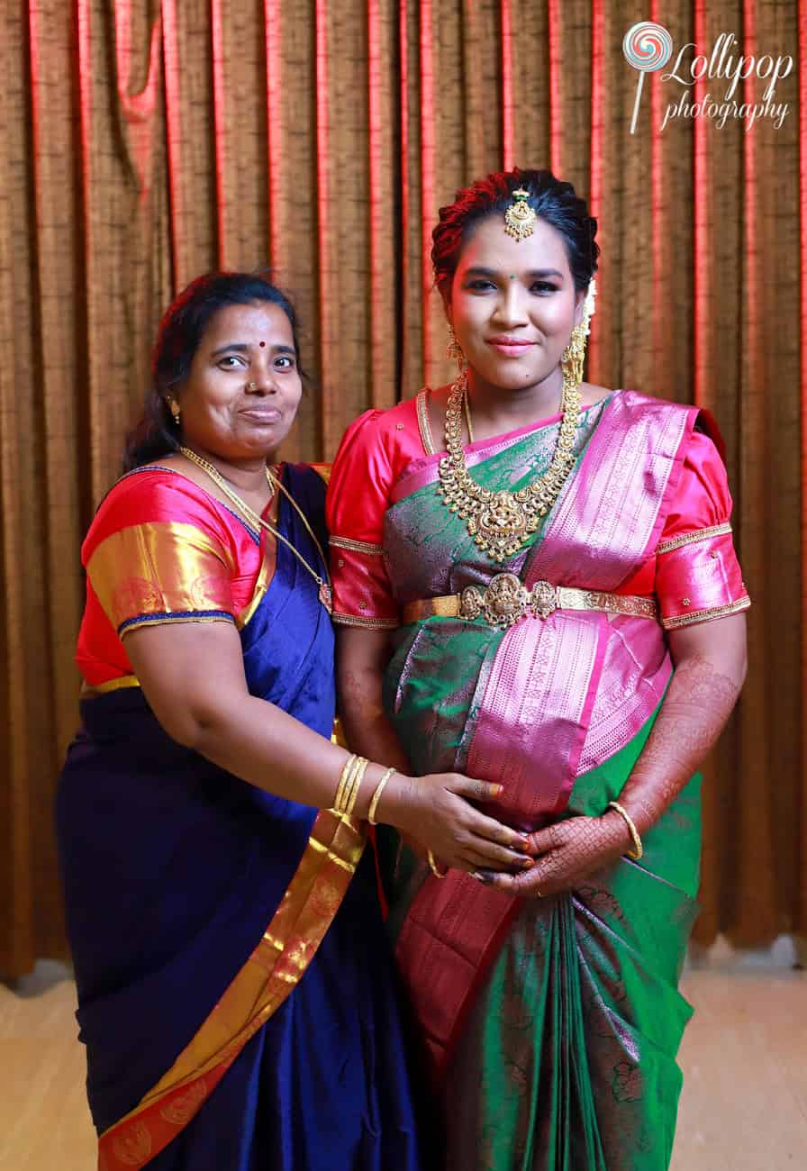 A heartwarming moment between mother and daughter as they celebrate the upcoming addition to the family, beautifully captured by Lollipop Photography