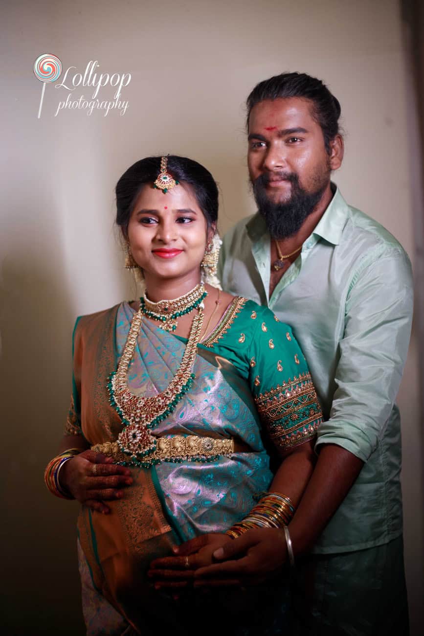 Sharmila and her spouse share a joyful moment at her baby shower, captured by Lollipop Photography in Coimbatore