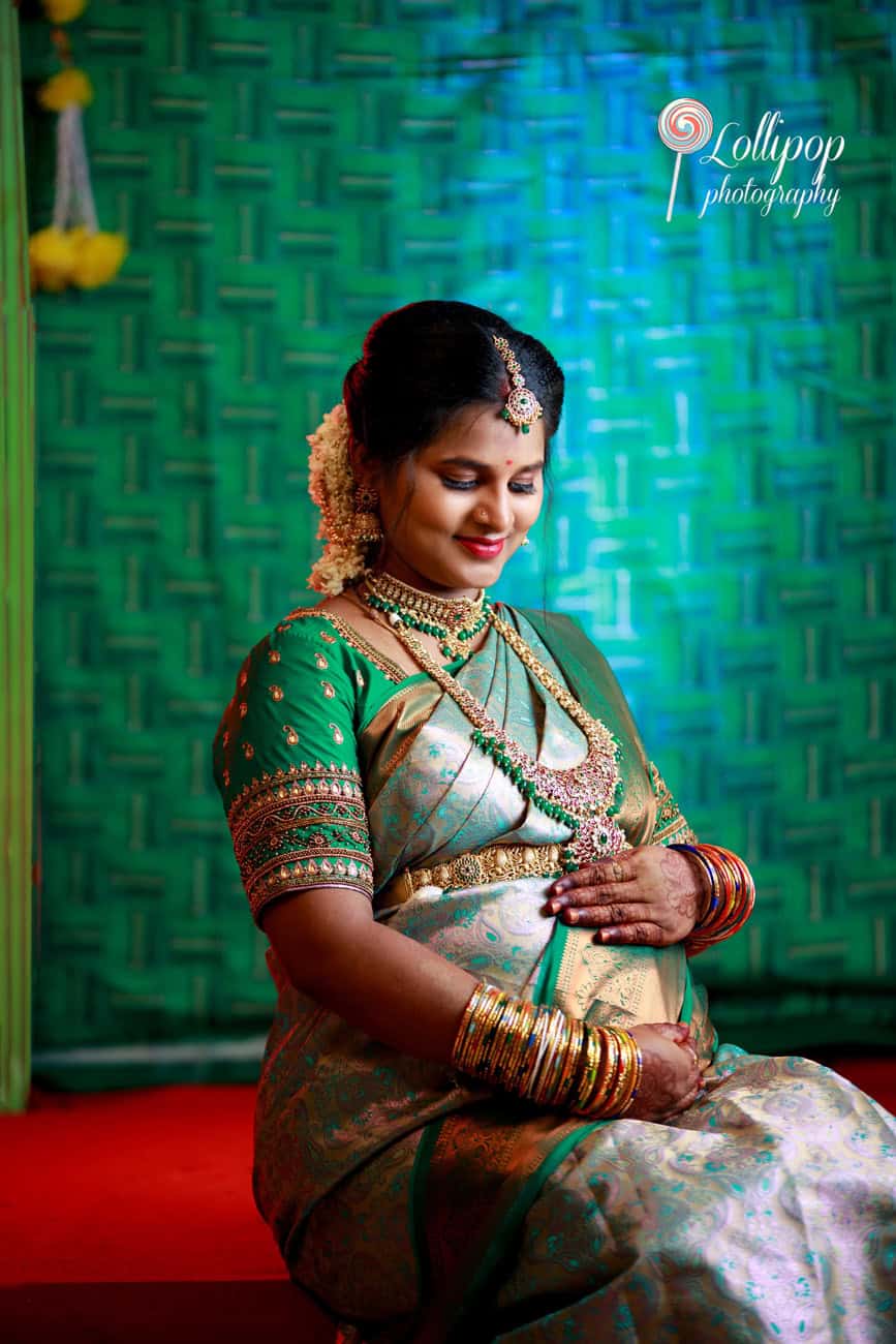 Sharmila gracefully embraces the moment at her baby shower, captured beautifully by Lollipop Photography in Coimbatore.