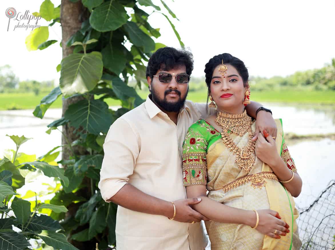 A tender embrace between Anitha and her husband, capturing their love and excitement for their growing family in Coimbatore.