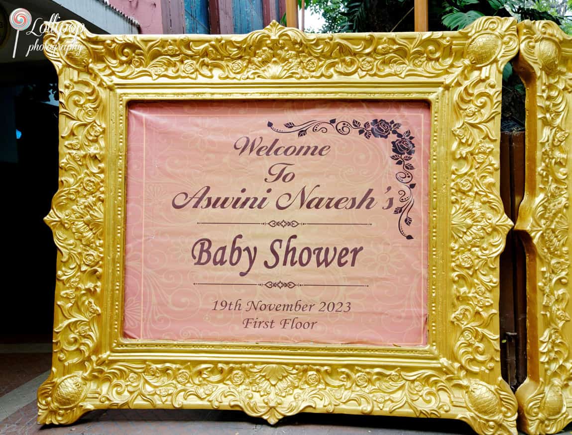 A grand golden frame welcomes guests to Aswini Naresh’s baby shower, captured by Lollipop Photography in Chennai